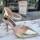 Gouden pumps met wreefbandje en naaldhak Gouden hoge hakken met bandje
